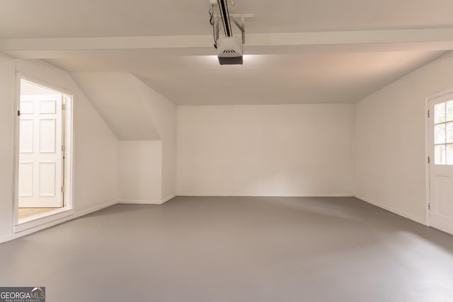 5674 Mountain Cres, Stone Mountain, GA 30087 - garage featuring a garage door opener and baseboards