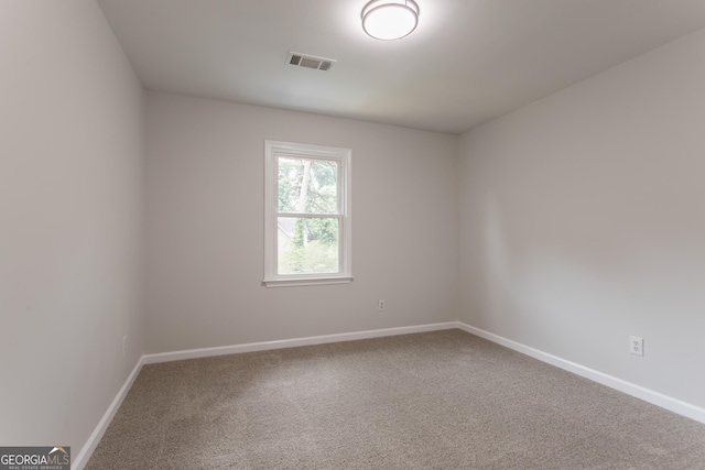 5674 Mountain Cres, Stone Mountain, GA 30087 - carpeted empty room featuring baseboards