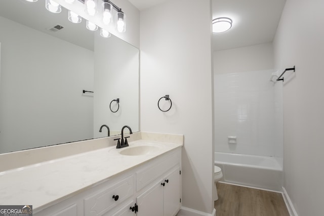 5674 Mountain Cres, Stone Mountain, GA 30087 - full bath featuring vanity, wood finished floors, and bathing tub / shower combination