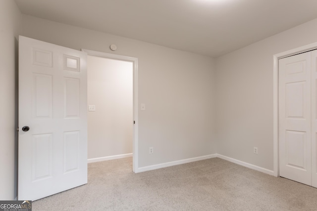 5674 Mountain Cres, Stone Mountain, GA 30087 - unfurnished bedroom featuring light colored carpet and baseboards