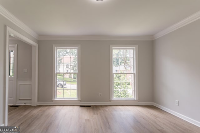 5674 Mountain Cres, Stone Mountain, GA 30087 - spare room featuring light wood-type flooring, plenty of natural light, and ornamental molding