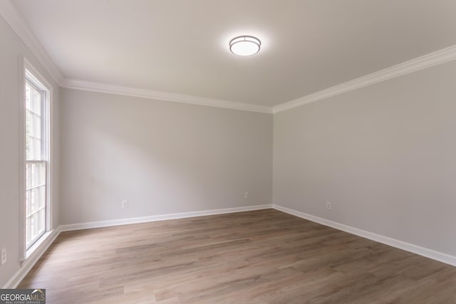 5674 Mountain Cres, Stone Mountain, GA 30087 - empty room featuring crown molding and wood finished floors