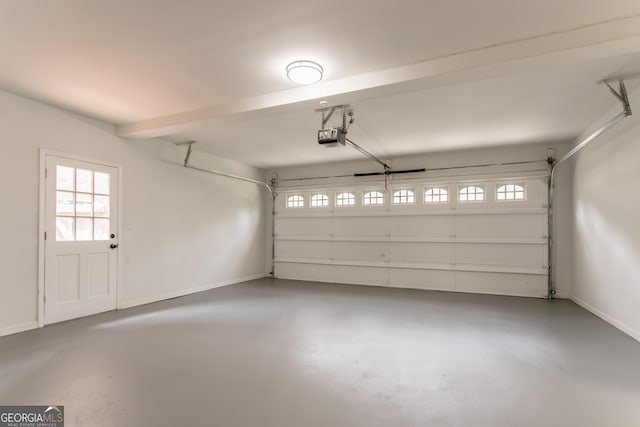 5674 Mountain Cres, Stone Mountain, GA 30087 - garage featuring a garage door opener and baseboards