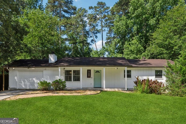 3123 Deshong Dr, Stone Mountain, GA 30087 - ranch-style home featuring a garage, a front yard, driveway, a chimney, and covered porch