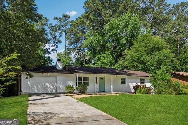 3123 Deshong Dr, Stone Mountain, GA 30087 - ranch-style house featuring an attached garage, concrete driveway, a front yard, a porch, and a chimney