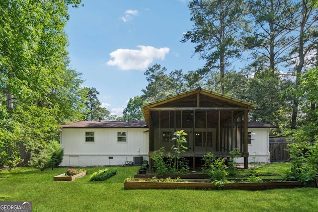 3123 Deshong Dr, Stone Mountain, GA 30087 - back of property featuring a vegetable garden, a sunroom, and crawl space