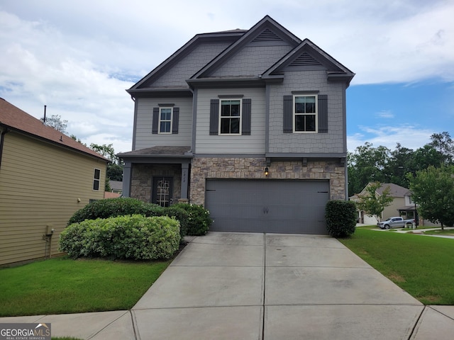 2424 Saint Andrews Rdg, College Park, GA 30337 - craftsman-style house with a garage, stone siding, concrete driveway, and a front yard