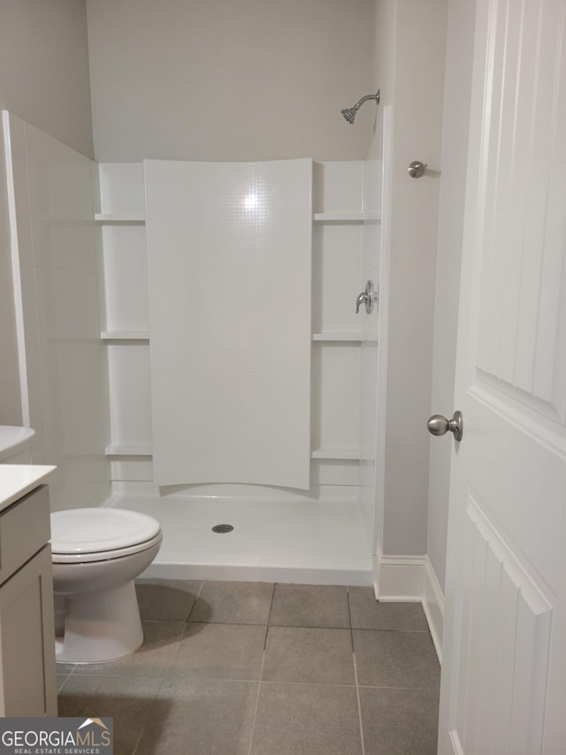 2424 Saint Andrews Rdg, College Park, GA 30337 - bathroom with vanity, a walk in shower, and tile patterned flooring
