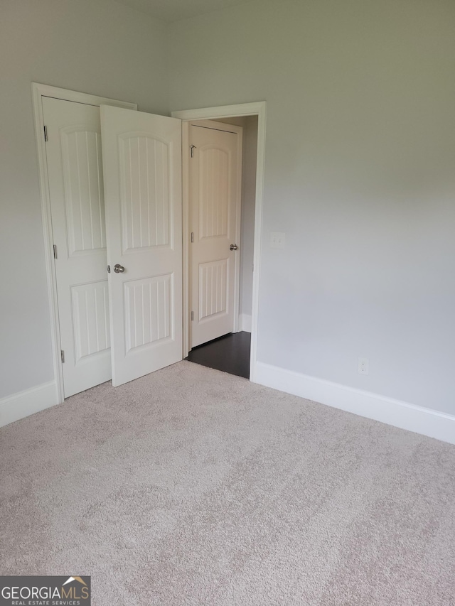2424 Saint Andrews Rdg, College Park, GA 30337 - unfurnished bedroom featuring dark colored carpet
