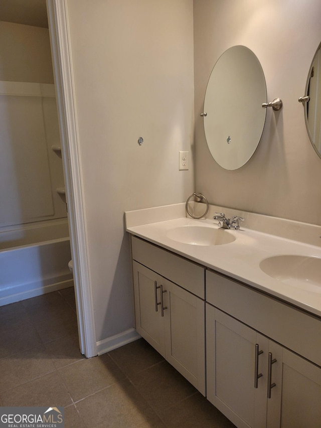 2424 Saint Andrews Rdg, College Park, GA 30337 - bathroom featuring double vanity, tile patterned flooring, and shower / bathtub combination