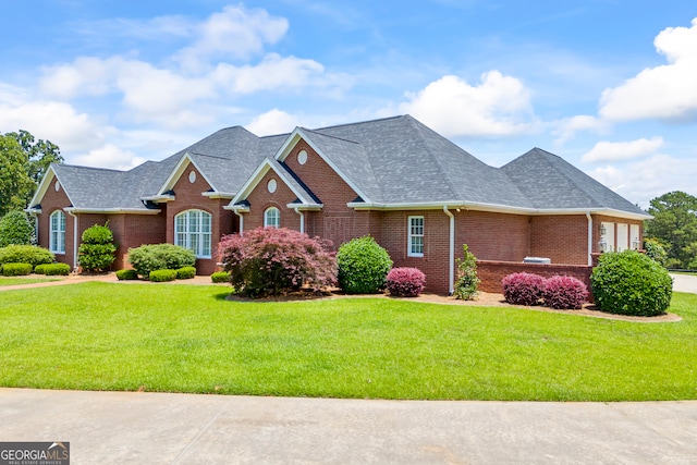 152 Lace Field Ln, Lavonia, GA 30553 - view of front of home with brick siding, a shingled roof, and a front yard