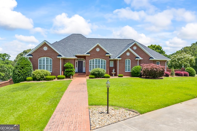 152 Lace Field Ln, Lavonia, GA 30553 - traditional home featuring brick siding, a shingled roof, and a front yard