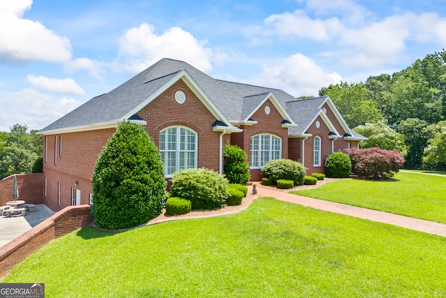 152 Lace Field Ln, Lavonia, GA 30553 - view of front facade featuring brick siding, a front lawn, and a shingled roof