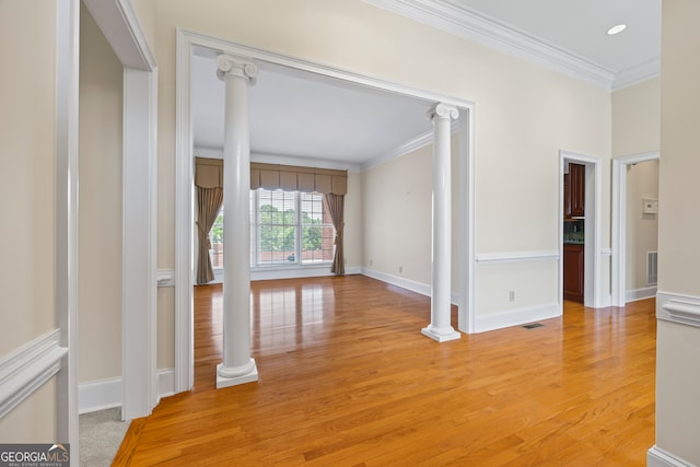 152 Lace Field Ln, Lavonia, GA 30553 - spare room with crown molding, decorative columns, light wood-style flooring, and recessed lighting