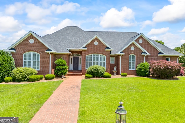 152 Lace Field Ln, Lavonia, GA 30553 - view of front facade featuring a shingled roof, brick siding, and a front yard