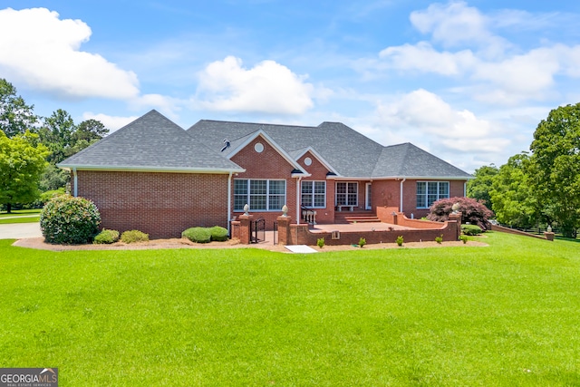 152 Lace Field Ln, Lavonia, GA 30553 - rear view of property featuring brick siding, a yard, and roof with shingles