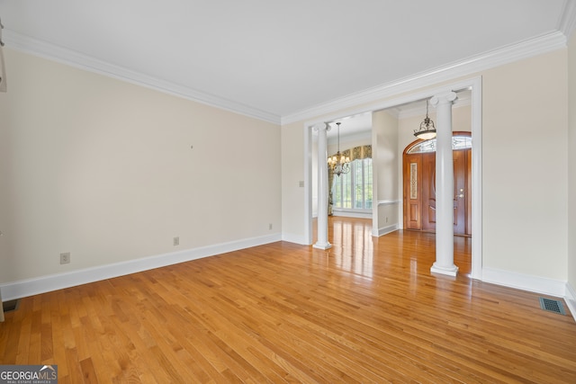 152 Lace Field Ln, Lavonia, GA 30553 - empty room featuring ornamental molding, a chandelier, light wood finished floors, and decorative columns