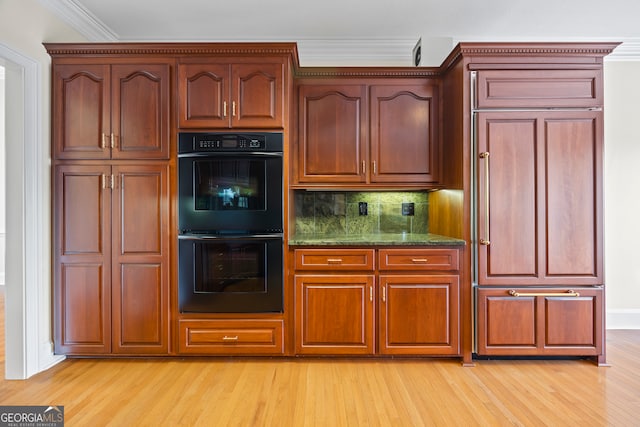 152 Lace Field Ln, Lavonia, GA 30553 - kitchen with light wood-type flooring, ornamental molding, decorative backsplash, stone counters, and paneled fridge