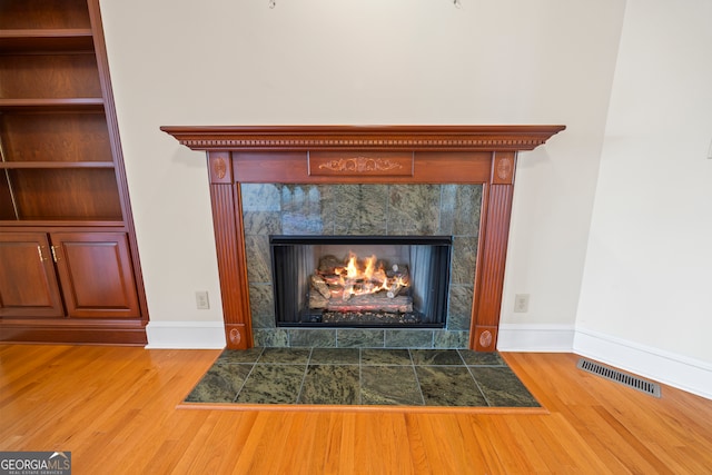152 Lace Field Ln, Lavonia, GA 30553 - detailed view of wood finished floors and a tile fireplace