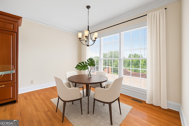 152 Lace Field Ln, Lavonia, GA 30553 - dining space featuring crown molding, a chandelier, and light wood-type flooring