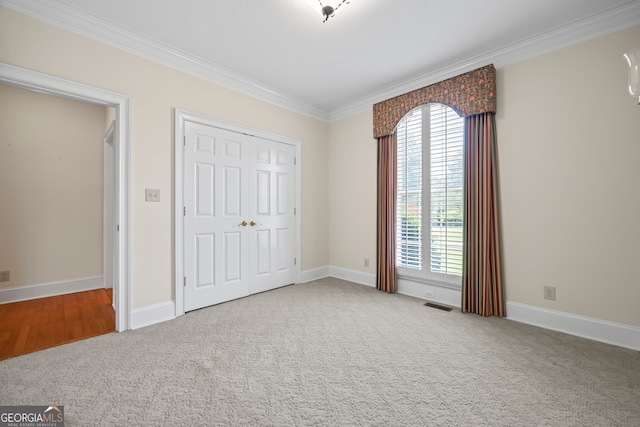 152 Lace Field Ln, Lavonia, GA 30553 - unfurnished bedroom with ornamental molding, carpet floors, and a closet