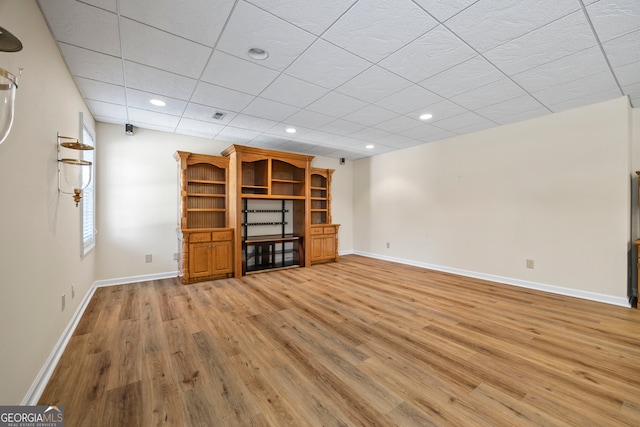 152 Lace Field Ln, Lavonia, GA 30553 - unfurnished living room featuring light wood-style floors, recessed lighting, and a paneled ceiling