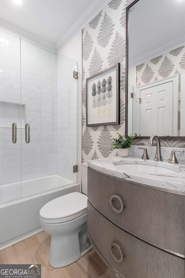 5414 Manteo Inlt, Peachtree Corners, GA 30092 - bathroom with vanity, wallpapered walls, shower / bath combination with glass door, ornamental molding, and wood finished floors
