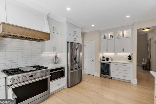 5414 Manteo Inlt, Peachtree Corners, GA 30092 - kitchen with appliances with stainless steel finishes, beverage cooler, light countertops, white cabinetry, and recessed lighting