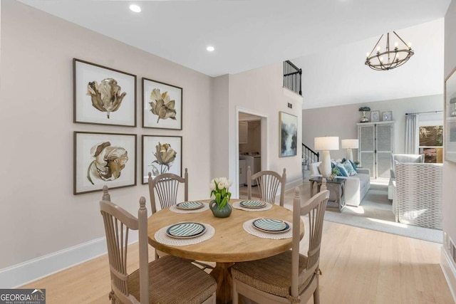 5414 Manteo Inlt, Peachtree Corners, GA 30092 - dining area with washing machine and dryer, light wood-style floors, a chandelier, and recessed lighting
