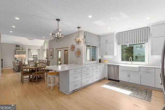 5414 Manteo Inlt, Peachtree Corners, GA 30092 - kitchen featuring dishwasher, a peninsula, light wood-style floors, tasteful backsplash, and recessed lighting