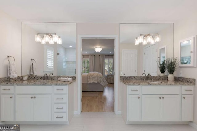 5414 Manteo Inlt, Peachtree Corners, GA 30092 - ensuite bathroom with a tile shower, two vanities, and tile patterned floors