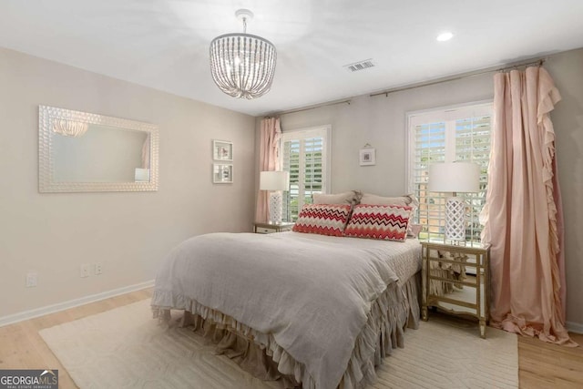 5414 Manteo Inlt, Peachtree Corners, GA 30092 - bedroom with a chandelier, wood finished floors, and recessed lighting