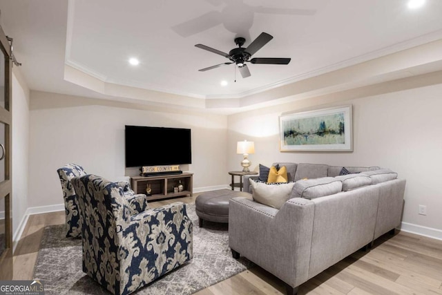 5414 Manteo Inlt, Peachtree Corners, GA 30092 - living room featuring a tray ceiling, ornamental molding, recessed lighting, wood finished floors, and ceiling fan