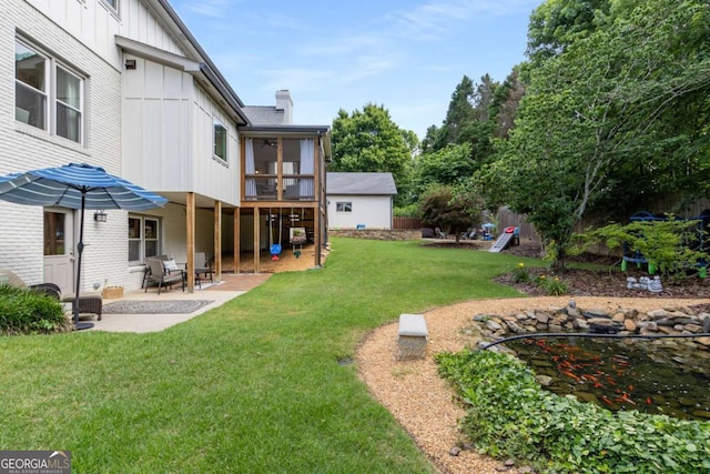 5414 Manteo Inlt, Peachtree Corners, GA 30092 - view of green lawn featuring a sunroom and a patio