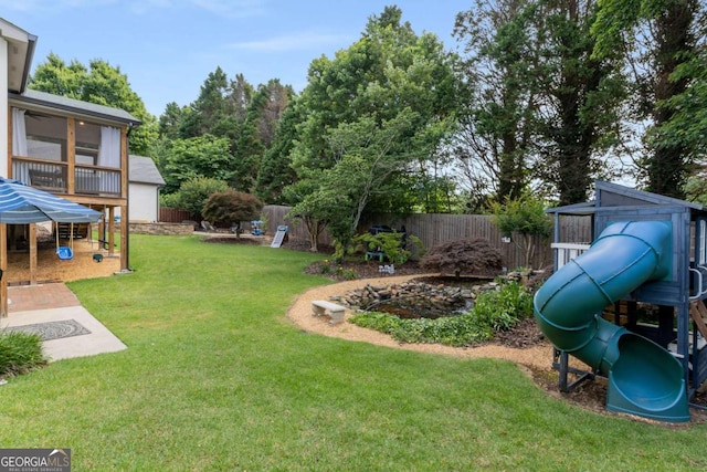 5414 Manteo Inlt, Peachtree Corners, GA 30092 - fenced backyard with a playground and a sunroom