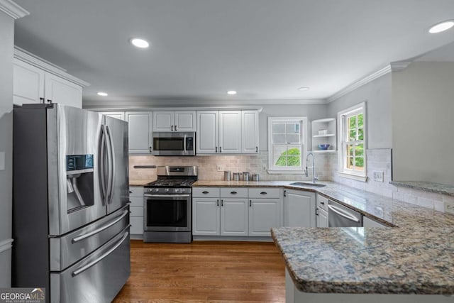 2864 Wyndcliff Ct, Marietta, GA 30066 - kitchen with appliances with stainless steel finishes, crown molding, dark wood-type flooring, white cabinets, and light stone counters