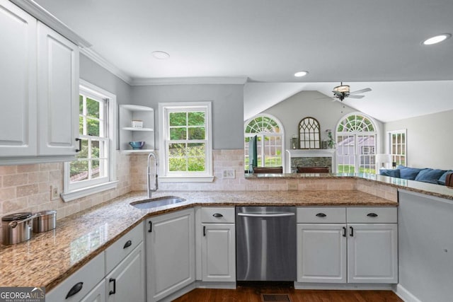 2864 Wyndcliff Ct, Marietta, GA 30066 - kitchen with stainless steel dishwasher, ceiling fan, dark wood-type flooring, a fireplace, and vaulted ceiling