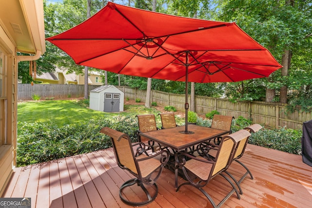 2864 Wyndcliff Ct, Marietta, GA 30066 - wooden deck with outdoor dining area, a fenced backyard, and a shed