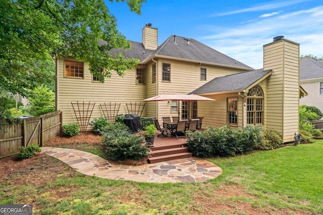 2864 Wyndcliff Ct, Marietta, GA 30066 - back of property with a chimney, a wooden deck, a shingled roof, and outdoor dining space