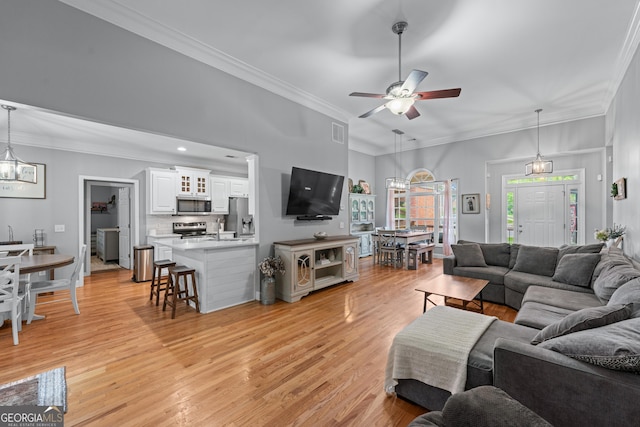1436 Virginia Way, Monroe, GA 30655 - living area featuring ceiling fan, light wood-style flooring, and crown molding