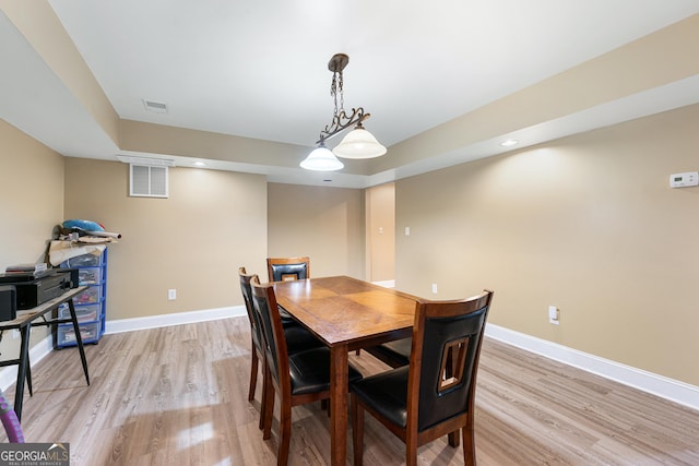 1436 Virginia Way, Monroe, GA 30655 - dining area featuring light wood-style flooring, a raised ceiling, and recessed lighting