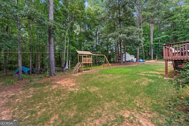 1436 Virginia Way, Monroe, GA 30655 - view of green lawn featuring a playground and a wooden deck