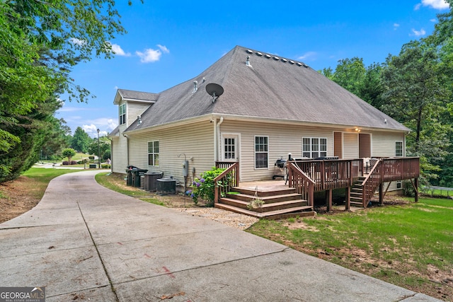 1436 Virginia Way, Monroe, GA 30655 - back of property featuring a deck, a lawn, and a shingled roof