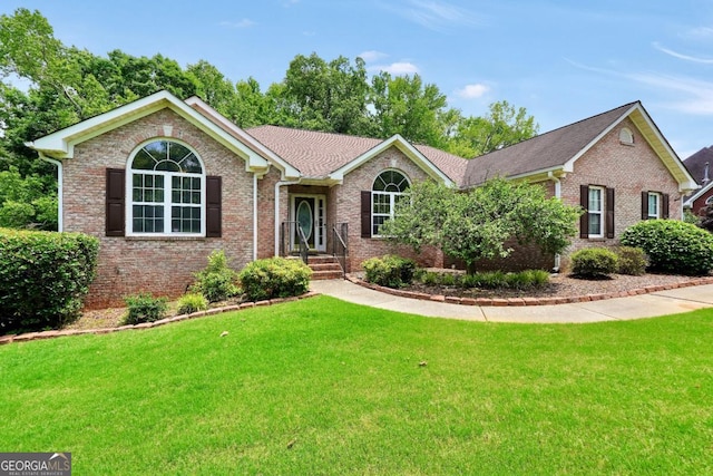 186 Ashley Dr, Mcdonough, GA 30252 - ranch-style house featuring a front yard and brick siding