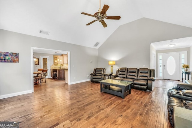 186 Ashley Dr, Mcdonough, GA 30252 - living room featuring ceiling fan, light wood-style floors, and vaulted ceiling