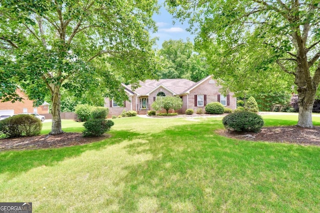 186 Ashley Dr, Mcdonough, GA 30252 - ranch-style house featuring a front yard and brick siding