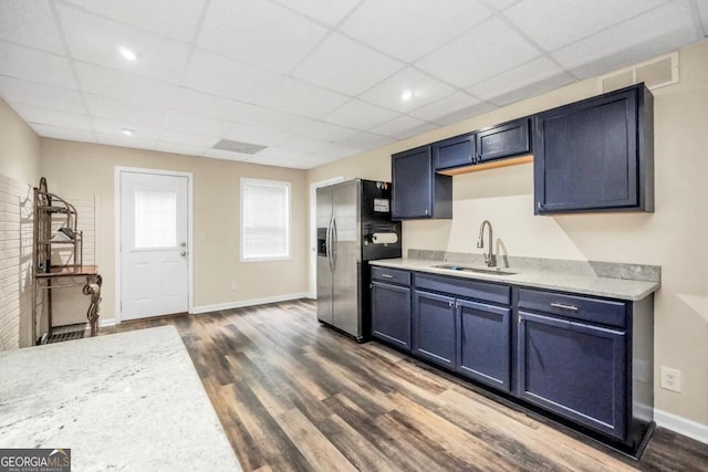 186 Ashley Dr, Mcdonough, GA 30252 - kitchen featuring stainless steel refrigerator with ice dispenser, dark wood-style floors, a paneled ceiling, and blue cabinetry