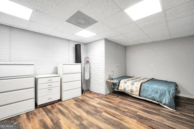 186 Ashley Dr, Mcdonough, GA 30252 - bedroom with wood finished floors and a paneled ceiling