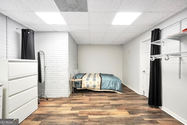 186 Ashley Dr, Mcdonough, GA 30252 - bedroom with wood finished floors and a drop ceiling