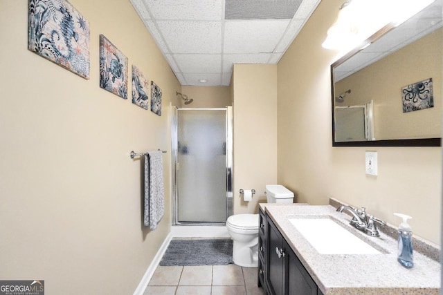 186 Ashley Dr, Mcdonough, GA 30252 - bathroom with a shower with door, tile patterned floors, vanity, and a paneled ceiling